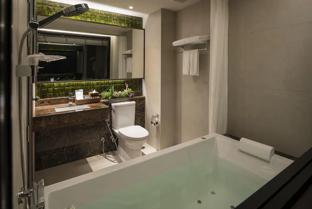 Deluxe bathroom with bath and rainfall shower