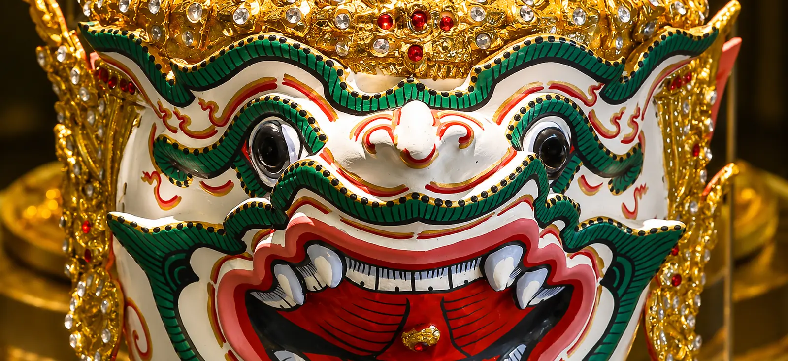 Retouched close-up of an ornate Thai Hanuman theatrical mask